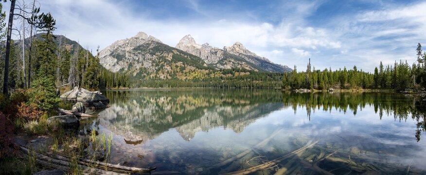 Reflection in Taggart Lake, view of the Teton Range, peaks Grand Teton and Teewinot Mountain, Grand Teton National Park, Wyoming, USA