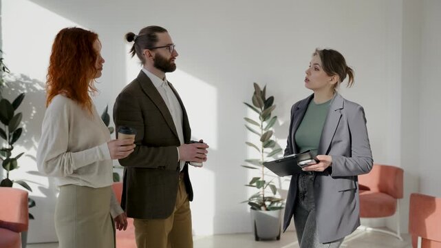 Business people talking, expressing doubt and frustration during a discussion. Colleagues having a serious conversation in a modern office