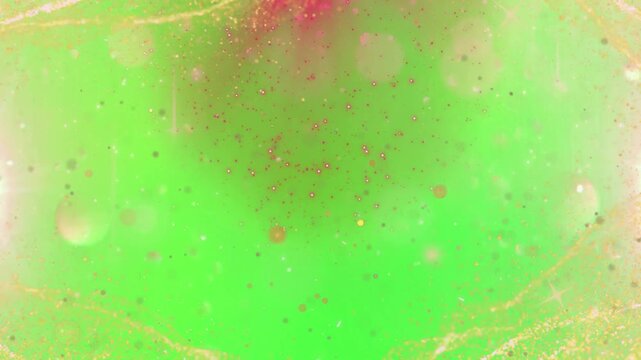 A vibrant green video background with sparkling lights and a red glow