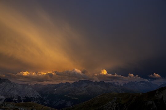 Engadine mountains with cloudy sky at sunset, St Moritz, Engadine, Grisons, Switzerland