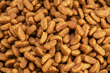 Dry pet food or kibbles close up. © Екатерина Иванова