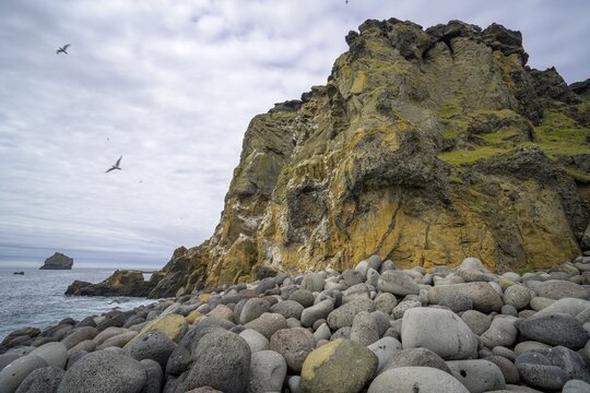 Cliff and large round stones, Grindavik, Su&eth;urnes, Iceland