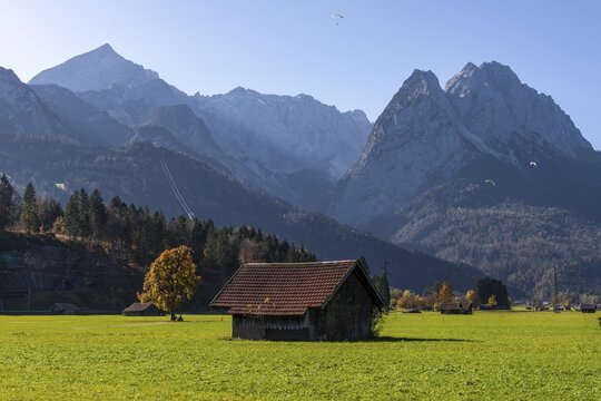 Hay barn, green meadow, Zugspitze in the background, mountain landscape, near Grainau, Garmisch-Partenkirchen, Upper Bavaria, Bavaria, Germany