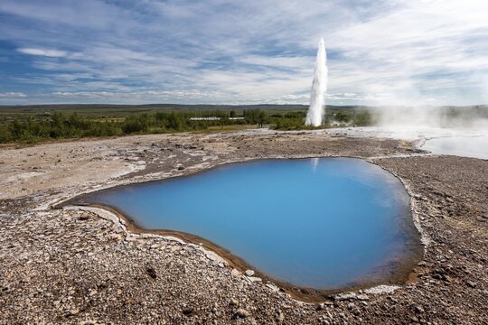 Thermal spring Blesi and eruption Geysir Strokkur, geothermal area Haukadalur, Geysir, Iceland