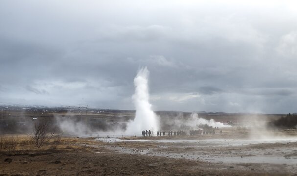 People watching the eruption of Geysir Strokkur, Haukadalur Geothermal Field, Golden Circle, South Iceland, Iceland