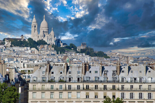 Basilica Sacre-Coeur sits atop the hillside in Montmartre district, Paris