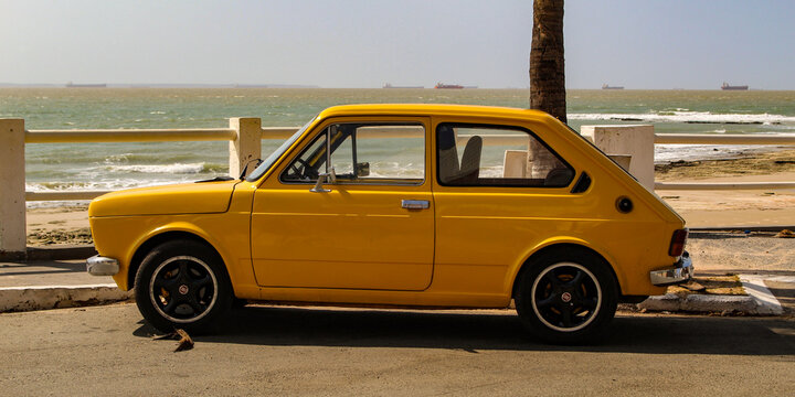 A yellow Fiat 147, the first car model produced by Fiat in Brazil between 1976 and 1986, based on the Italian 127, parked in S&atilde;o Lu&iacute;s, Maranh&atilde;o, Brazil.