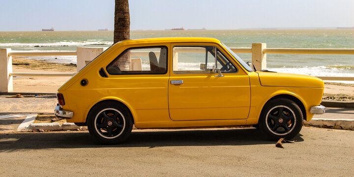 A yellow Fiat 147, the first car model produced by Fiat in Brazil between 1976 and 1986, based on the Italian 127, parked in S&atilde;o Lu&iacute;s, Maranh&atilde;o, Brazil.