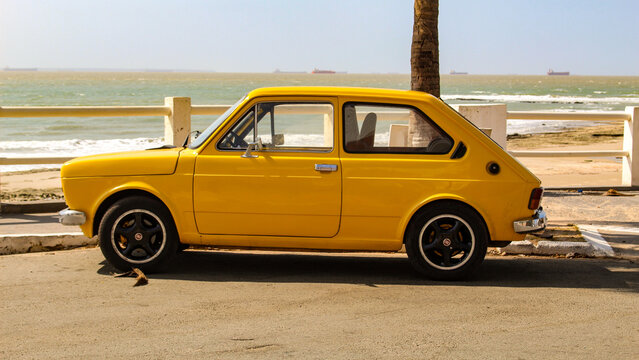 A yellow Fiat 147, the first car model produced by Fiat in Brazil between 1976 and 1986, based on the Italian 127, parked in S&atilde;o Lu&iacute;s, Maranh&atilde;o, Brazil.