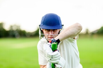 Focused cricketer ready to play