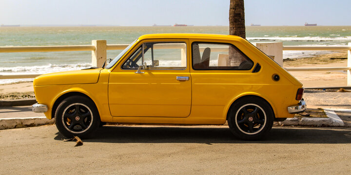 A yellow Fiat 147, the first car model produced by Fiat in Brazil between 1976 and 1986, based on the Italian 127, parked in S&atilde;o Lu&iacute;s, Maranh&atilde;o, Brazil.