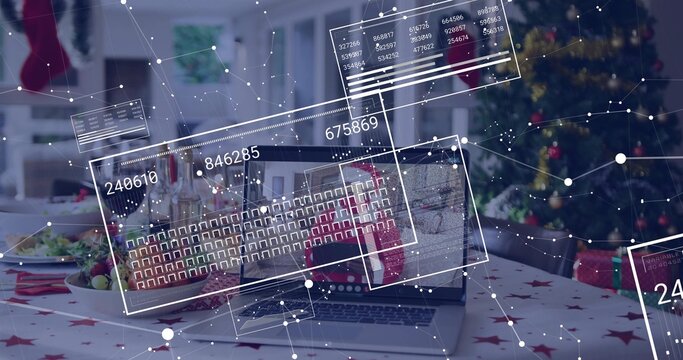 Displaying open laptop showing keyboard and AR overlays at dining table with red star tablecloth