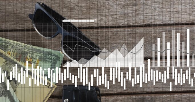 Displaying dark-framed sunglasses lying diagonally on wooden plank, with cash, car key and charts