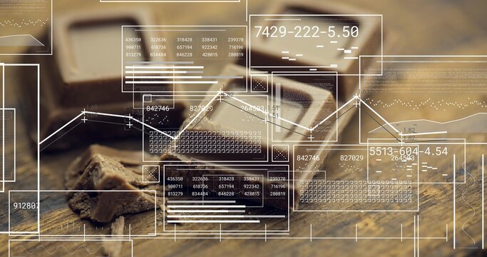 Displaying broken dark chocolate squares sitting on wooden cutting board, with digital HUD overlays