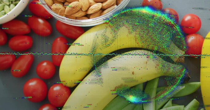 Showing ripe yellow bananas centering on dark counter, tomatoes, almonds, peas, scanline crossing