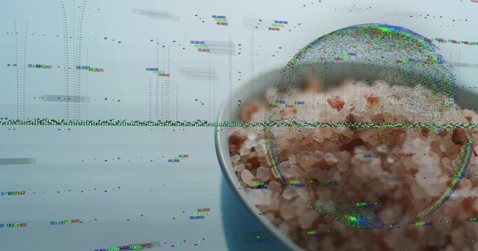 Glitching wide band revealing white-rim bowl magnifying pink rock salt on blue table, copy space