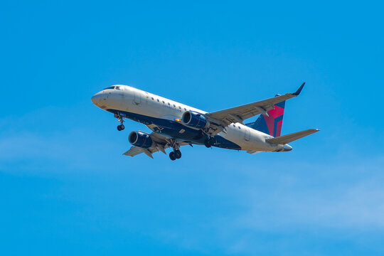 Delta Air Lines Connection Embraer ERJ-175 N213JQ landing on Boston Logan International Airport, Boston, Massachusetts MA, USA.