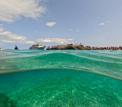 Underwater image in the clear waters of the Mediterranean Sea in Sardinia during summer while snorkeling.

Cala Mariolu maintains its wild essence to preserve the ecosystem of the Gulf of Orosei.