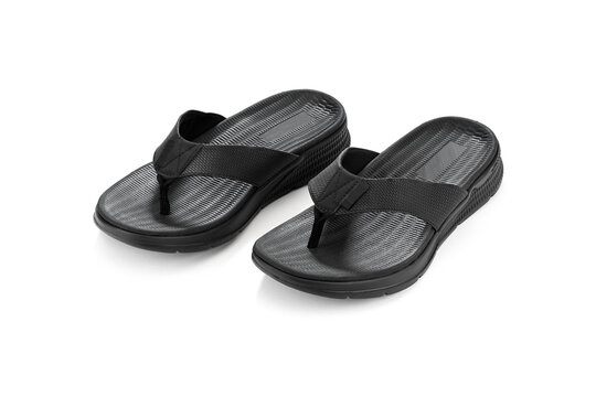Pair of black flip flops isolated on white background. Image created by focus stacking technique for corner to corner sharpness. 
