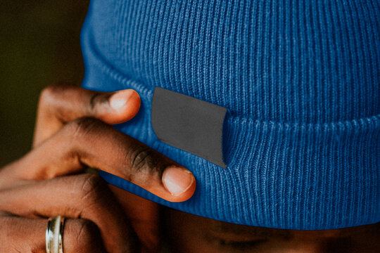 Blue beanie with hand detail, blank clothing suitable as mockup
