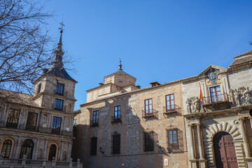 Fototapeta premium Toledo,Spain,Historic stone buildings with arched windows and a bell tower