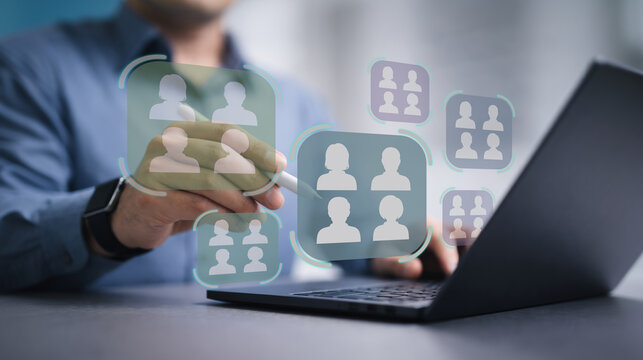Customer targeting and segmentation concept. Analysis of audience groups, customer profiles, behavioral data, market segmentation. Marketer using laptop computer to analyze customer targeting strategy