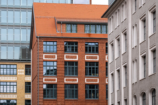 Urban corporate brick architecture of offices and buildings facade with windows and repeating pattern for industry inspired real estate and business background