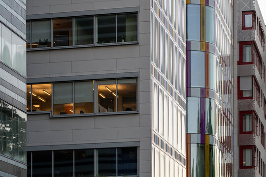 Modern urban corporate offices and buildings facade with glass windows and clean architecture reflections creating a geometric pattern for city business background