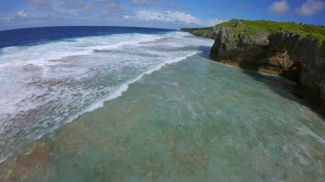 FPV Drone Flying Over Volcanic Coast and Waves in Niue