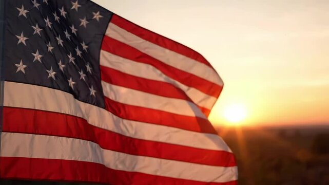 American flag waving in the wind at sunset with a beautiful sky