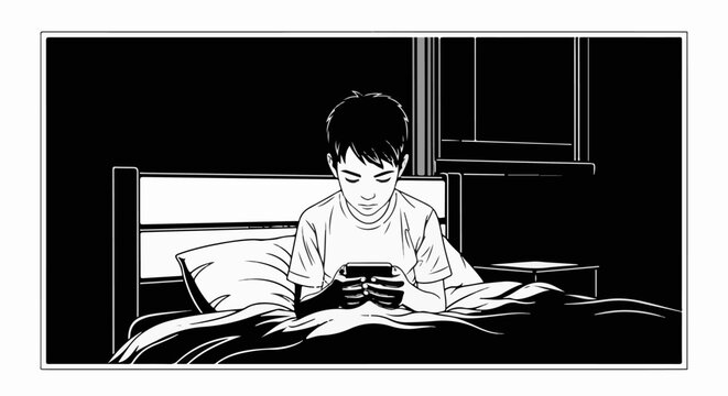 Young boy engrossed in mobile phone while lying in bed at night