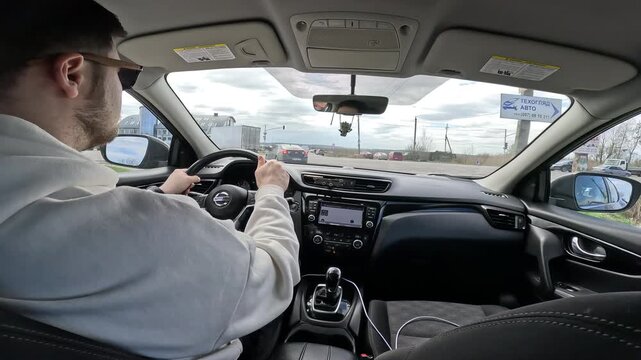 Driver Navigating City Traffic at Intersection