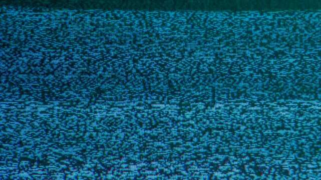 Color Noise on the Screen. Loop. The screen of an old TV, which broadcasts on-air interference inherent in an analog signal - white noise, interlacing, distortion and interference