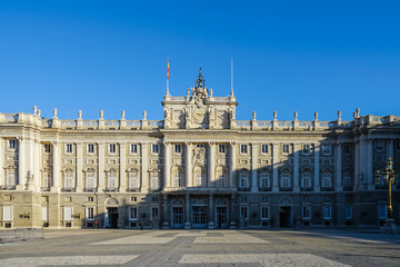 Obraz premium Spain,Royal Palace of Madrid, a grand neoclassical building with ornate fa?ade and clear blue sky