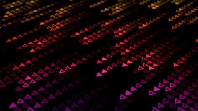 Looped animation of glowing neon triangles arranged in digital stream patterns on a black background. Bright geometric elements in contrast yellow orange red pink and purple gradient colors. 4K 60fps