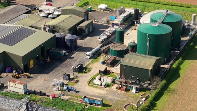 Aerial view of an anaerobic digestion AD plant with large green biogas storage domes in Lincolnshire