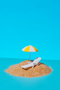 a miniature beach scene on a blue background