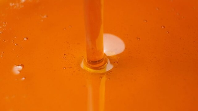 Natural maple syrup flow, slow motion.