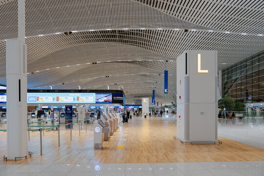 April 20, 2026, Incheon, South Korea - Interior view of Incheon International Airport Terminal 2 with self-service kiosks and digital displays