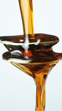 Creative conceptual shot of maple syrup and spoons