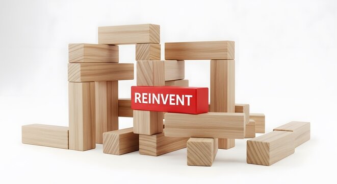 transformation concept, block labeled REINVENT, symbol of rebuilding, adaptation and personal or business renewal
