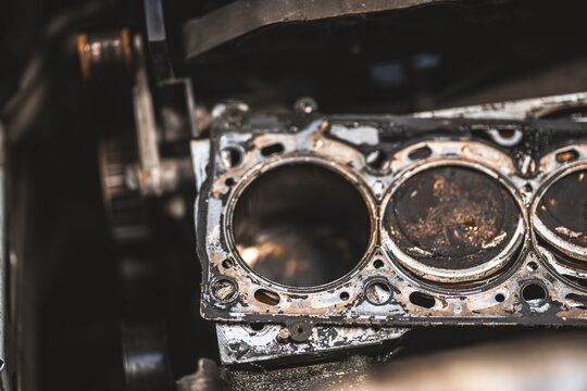 Close-up of a worn and dirty car engine cylinder head gasket