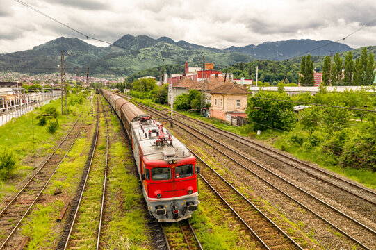 Aerial view of train on railway in the city of Brasov, Romania.
