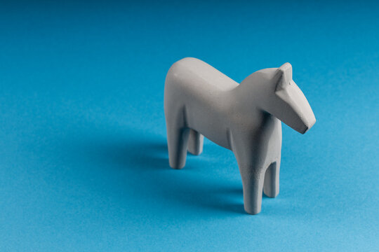 wooden horse on a blue background, top view