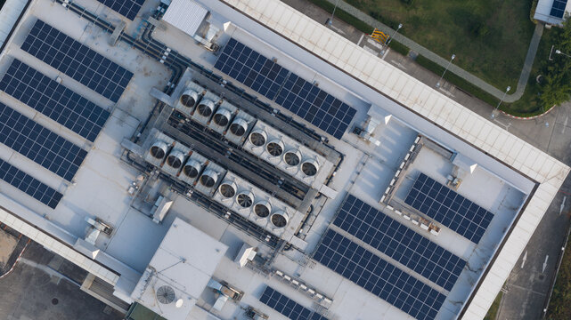 Aerial view of NTT Global Data Centers Thailand Limited with solar panels and industrial cooling systems on the rooftop in Tambon Don Huaro, Chang Wat Chon Buri, Thailand.