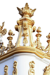 Obraz premium A gold and white clock tower with statues on top, suitable for travel or architecture illustrations vertical frame
