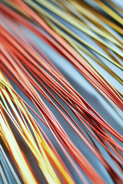 A close-up view of a tangled bunch of wires vertical frame