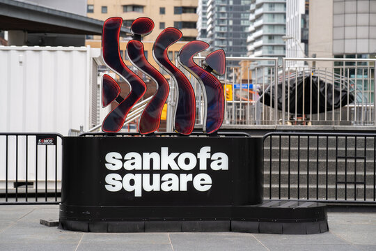 Sankofa Square sign with modern sculpture in downtown Toronto. Toronto, Canada - April 19, 2026.