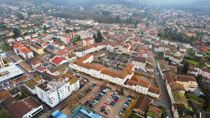 Obraz premium Aerial view around the city Ambérieu-en-Bugey in France on a low cloud afternoon in late winter.