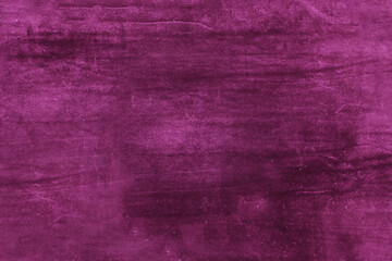 Fototapeta premium Rich velvet texture in deep magenta hue